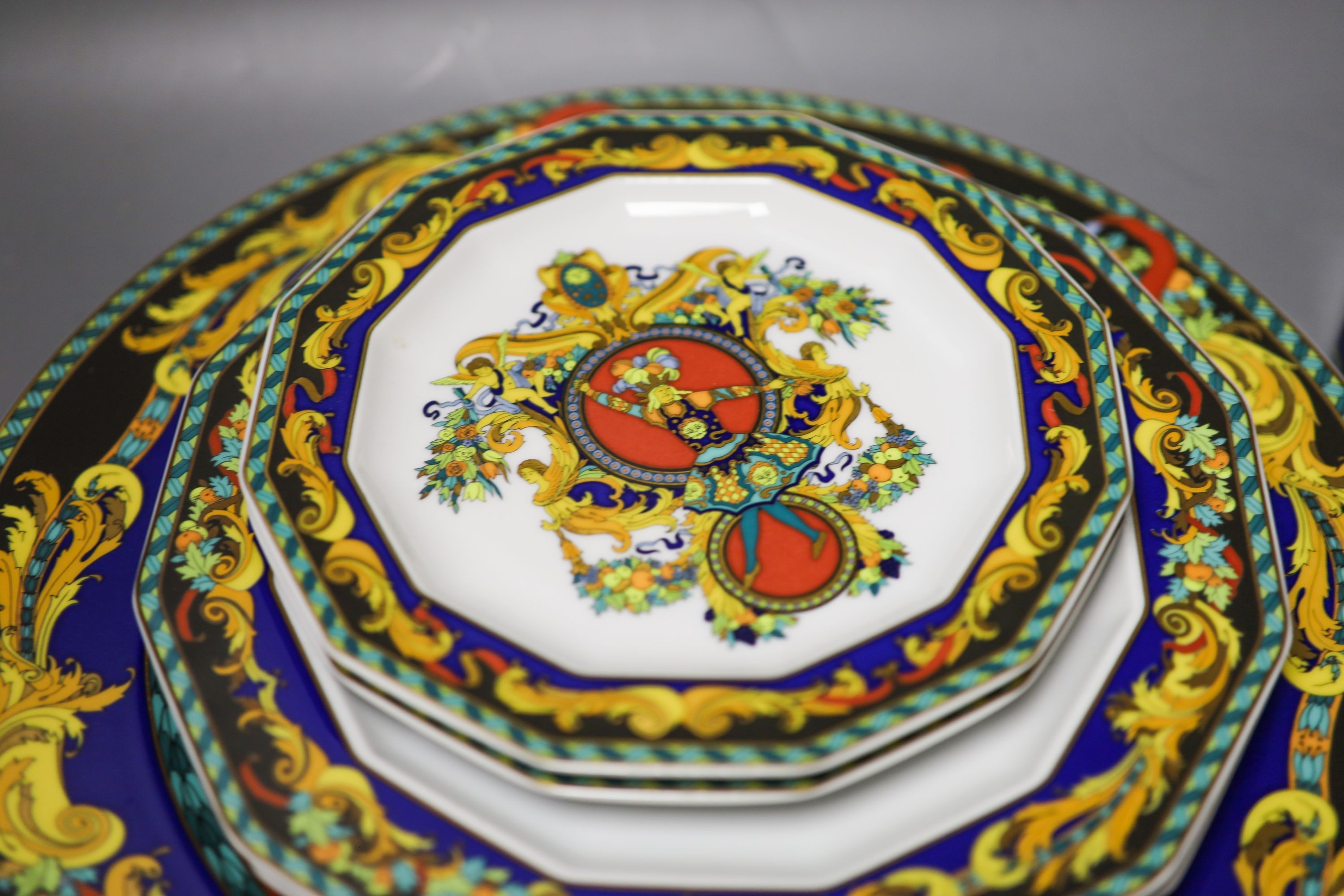 A group of Versace Rosenthal Le Roi Soleil plates and coffee cups and saucers and a bowl, 18.5cm, ten in total